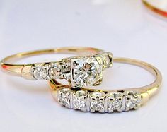 two diamond rings sitting on top of each other