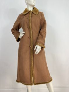 "Faux suede coat, vintage coat, size women's small * see last couple pictures, there's a small hole on the bottom left side of jacket (barely noticeable), also some small marks near the bottom (shown in picture)and possibly a few darker spots other places because the coat is very light, nothing very noticeable  Measurements:  Shoulder 18\"/sleeve(uncuffed)22\"/bust (pit-pit)19\"/waist 18.5\"/hip 21\"/length 44\" Mannequin measurements:  5'8\", bust 34\", waist 25\", hip 33\" Please note that vintage clothing sizes can vary greatly.  The Measurements provided  are approximate and are taken lying flat.  I suggest taking a similar garment from your wardrobe and measure it while lying flat.  This way you can compare measurements.   Don't forget to enlarge the photos and take a closer look at t Long Sleeve Suede Fur Coat For Winter, Fall Suede Fur Coat, Suede Fur Coat For Fall, Winter Suede Fur Coat With Long Sleeves, Vintage Long Fur Coat For Fall, Vintage Suede Outerwear For Fall, Winter Suede Outerwear With Button Closure, Vintage Suede Long Sleeve Outerwear, Vintage Suede Outerwear For Winter