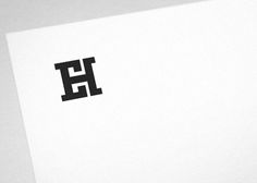 the letter e is placed on top of a piece of white paper with black lettering