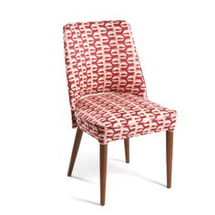 a red and white patterned chair with wooden legs