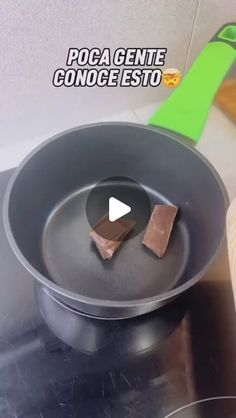 a pan with some food in it on top of a stove next to a spatula