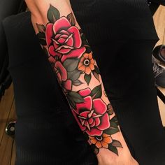 a woman's arm with flowers on it