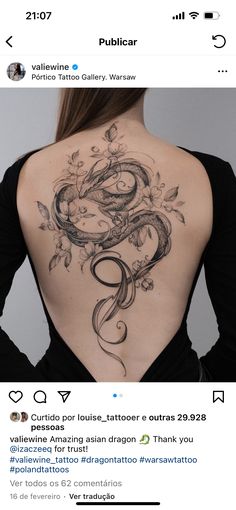 the back of a woman's neck with a tattoo on her upper and lower part