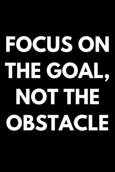 the words focus on the goal, not the obstacle are white against a black background