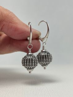 Sterling Silver Earrings Dangle. Leverback Earrings. These sterling silver Bali ball bead earrings are handmade. 12.3 mm wide, oxidized beads decorated with lines and granules are mounted with Euro-style leverback earring wires. The set is 1 1/2 inches (3.8 cm) in long. Pictures are enlarged to show detail. These are the lovely Bali sterling silver leverback earrings you will receive. Gift for Wife, Girlfriend Gift, Gift for Mom, Gift for Sister, Gift for Her, Gift for Women. The earrings ship in a small organza bag inside a gift box, ready to give... or keep! To see more WireAndPearl Sterling Silver Earrings, please visit: https://www.etsy.com/shop/WireAndPearl?section_id=18630564 Also, WireAndPearl Gold Filled and Vermail Earrings can be found here: https://www.etsy.com/shop/WireAndPearl Gift Sterling Silver Pierced Beaded Earrings, Pierced Sterling Silver Beaded Earrings As Gift, Unique Sterling Silver Beaded Earrings, Silver Beaded Drop Earrings As Gift, Silver Beaded Drop Earrings For Gift, Sterling Silver Beaded Earrings For Jewelry Making, Silver Teardrop Beaded Earrings As Gift, Sterling Silver Beaded Earrings As Gift, Silver Teardrop Beaded Earrings For Gift