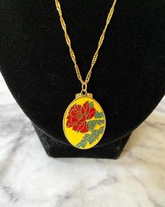 Vintage small yellow floral red hibiscus cloisonné enamel oval pendant on 18K gold plated wave chain. I cleaned the pendant to the best of my abilities. The jump ring is 18K gold plated. Please keep in mind that the pendant itself is vintage so it may show some signs of age/wear which includes any signs of chipping or tarnishing. If you need a chain of another length, please select in the menu. If you need a chain length not listed, please send me a message. Necklace drop length of about 22-23 c Oval Necklace, Cloisonne Enamel, Oval Pendant, Yellow Floral, Hibiscus, Necklace Etsy, 18k Gold, Jewelry Necklace Pendant, Jewelry Necklaces