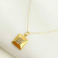 14K Solid Gold Charm. Square Pendant with Diamonds HIGH QUALITY & UNIQUE GEMSTONE CHARM This modern and on-trend design is crafted from genuine 14k Solid Gold, Diamonds & Gemstones! Item number: GDP143 Size: 10mm Thickness: 2mm Metal: 14k Solid Gold Purity: 14K (Stamped for Authenticity) Processing time: 1-2 business days FAST SHIPPING Gold Jewelry Store NY sells only authentic solid 14K Gold. We do not sell gold plated or gold-filled jewelry. They are unique and pair perfectly with any outfit. Solid Gold Charms, Gold Jewelry Stores, Square Stone, Diamond Quartz, Square Pendant, Sell Gold, Yellow Gold Chain, Unique Gemstones, Diamond Fashion