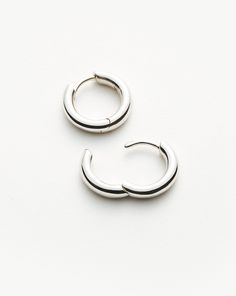 Classic Tunnel Mini Hoop Earrings | Sterling Silver. Introducing Our Lightest Ever Hoops — an Elevated Collection of Everyday Essentials that are Anything but Basic. An Upgrade on a Classic Silhouette, these Sleeper Tunnel Hoop Earrings Have Been Upgraded to be Lighter and Feature a Hidden Hinge for a Seamless Closure. Wear Solo or Style with Studs and Mini Hoops for an Instant Ear Stack. Also Available in Large and Medium. Metal: Rhodium Plated on Recycled Sterling Silver Hoop Dimensions: 13. 5 Medium Hoop Earrings, Small Hoop Earrings, Ear Stack, Mini Hoop Earrings, Star Earrings Stud, Large Hoop Earrings, Classic Mini, Pearl Stud Earrings, Sterling Silver Hoops