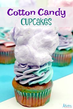 cotton candy cupcakes are stacked on top of each other