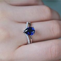 Blue Sapphire Ring Wedding Ring September Birthstone Ring Blue | Etsy Teardrop Sapphire Ring With Accent Stones For Anniversary, Anniversary Pear-shaped Sapphire Ring With Cubic Zirconia, Blue Pear-shaped Sapphire Ring With Accent Stones, Silver Teardrop Jewelry For Proposal, Silver Sapphire Ring With Pear-shaped Cubic Zirconia, Teardrop Sapphire Birthstone Ring For Anniversary, Teardrop Sapphire Anniversary Ring, Teardrop Sapphire Ring With Diamond For Gift, Pear-shaped Cubic Zirconia Sapphire Promise Ring