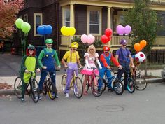 a group of people on bikes with balloons