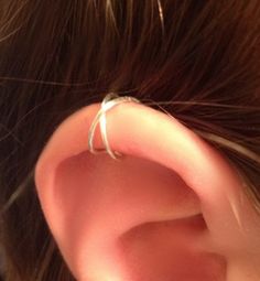 a close up of a person's ear with some wire attached to it