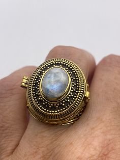 Vintage Rainbow Moonstone Brass Poison Pillbox Ring Gold Moonstone Ring For Spiritual Gift, Spiritual Gold Moonstone Ring As Gift, Gold Bohemian Moonstone Ring Gift, Bohemian Gold Moonstone Ring Gift, Bohemian Gold Moonstone Ring For Gift, Antique Cabochon Moonstone Ring Gift, Antique Cabochon Moonstone Ring For Gift, Antique Moonstone Cabochon Ring Gift, Vintage Gold Moonstone Ring For Gift