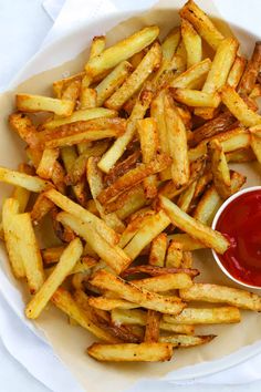 french fries with ketchup in a white bowl