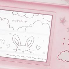 a pink electronic device with an image of a bunny on the screen