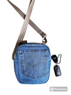 Lots of pockets on this upcycled Levis denim bag.  A back pocket from the jeans on the front, a zipper pocket on the back, and a slip pocket on the inside makes this the ideal bag for every day.   This will easily hold your phone, keys, some makeup, and sunglasses.   Three D-Rings allow you to use this bag as a shoulder bag or a crossbody. Staps easily attached using swivil hooks.  The lining is two tone gray fabric with a slip pocket (perfect for a phone) and has a light blue binding.   If you like this, check out what else I have in my shop. https://cottonandblueco.etsy.com Everyday Denim Shoulder Bag With Zipper, Denim Blue Shoulder Bag With Zipper For Everyday Use, Denim Shoulder Bag With Zipper For Travel, Denim Blue Shoulder Bag With Pockets For On-the-go, Denim Blue Crossbody Shoulder Bag With Pockets, Medium Wash Shoulder Bag With Pockets For Travel, On-the-go Denim Shoulder Bag With Zipper Pocket, Casual Denim Shoulder Bag With Zipper Pocket, Casual Denim Shoulder Bag For On-the-go