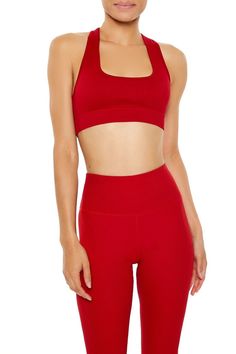 An athletic knit sports bra featuring a square neck, shoulder straps that form a crisscross back design, longline hem, seamless fit that sculpts, lifts, and smooths, breathable and moisture wicking fabric, and seams that lay flat for ultimate comfort. | 93% nylon, 7% spandex | Machine wash cold | Model is 5'9" and wearing a Small | Seamless Crisscross Sports Bra Stretch Crop Top With Strappy Back For Sports, Seamless Cross Back Sports Bra For Gym, Sports Stretch Crop Top With Cross Back, Sporty Seamless Crop Top With Cross Back, Sports Crop Top With Cross Back And Stretch, Sports Crop Top With Stretch And Cross Back, Sporty Crop Top With Strappy Back For Gym, Sporty Strappy Back Crop Top For Gym, Seamless Medium Support Sports Bra With Cross Back