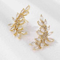 Introducing New Earrings “Ella” Cubic Zirconia Leaf Stud Brand : Sana Officials Insta : Sana_.Officials Based In Ny Deliver All Over Us Elegant Sparkling Gold-plated Earrings, Gold Cubic Zirconia Sparkling Diamond Earrings, Elegant Gold Plated Earrings With Rhinestones, Gold Bridal Earrings With Sparkling Cubic Zirconia, Gold Elegant Bridal Earrings With Rhinestones, Elegant Gold Bridal Earrings With Rhinestones, Elegant Diamond Earrings With Rhinestones For Gift, Elegant Gold Crystal Earrings With Prong Setting, Elegant Rhinestone Diamond Earrings As Gift