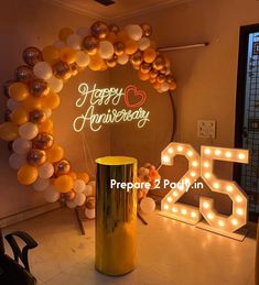 an anniversary celebration with balloons and lights