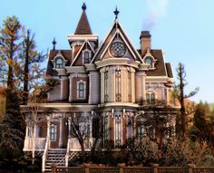 a large house with a clock on the top of it