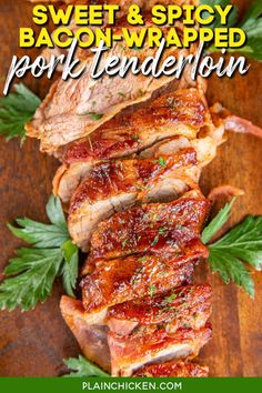 sweet and spicy bacon - wrapped pork tenderie on a cutting board with parsley