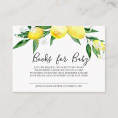 the lemon blossom baby shower book request card is shown on a marble surface with white flowers and green leaves