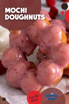 there are donuts with pink icing on top of each other and the words mochi doughnuts above them