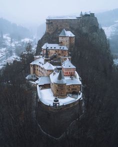 an aerial view of a castle in the snow