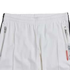 Prada track pants in white nylon with a dark grey side stripe. Brand = Prada Condition = 10/10, brand new with tags Size = Women's S Material = Nylon Blend SKU = 1-6634 White Nylon Pants For Streetwear, Sporty White Bottoms With Side Stripes, White Nylon Athleisure Pants, Streetwear White Nylon Bottoms, Track Pants Women, Side Stripe, Track Pants, Dark Grey, Prada