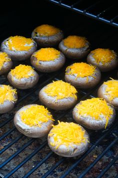 baked goods being cooked on the grill with grated cheese toppings and seasoning