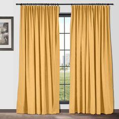 a yellow curtain hanging in front of a window