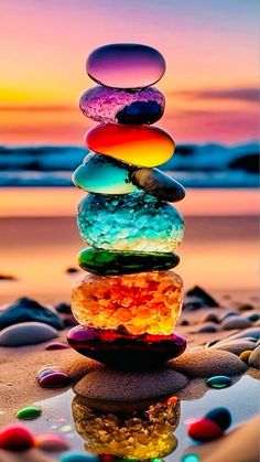 a stack of rocks sitting on top of a beach