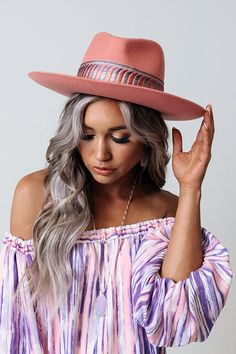 Make a statement in our eye-catching pink 'Make Amends' fedora featuring lightweight wool material, a curved 3-inch brim, and a wide serenity hued embroidered accent band!
 Hat Dimensions:
 Length - 15.5 Inches
 Width - 14.5 Inches
 Height - 5 Inches
 Cranial Circumference - 23 Inches Trendy Spring Hat With Flat Crown, Trendy Flat Crown Hat For Spring, Fitted Felt Hat With Flat Crown For Spring, Spring Beach Felt Hat With Flat Crown, Fitted Wide Brim Felt Hat For Spring, Spring Fitted Wide Brim Felt Hat, Pink Fitted Brimmed Fedora, Fitted Pink Brimmed Fedora, Pink Adjustable Hat Bands For Winter