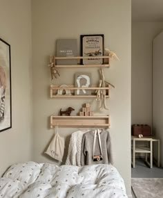 a bedroom with two shelves above the bed