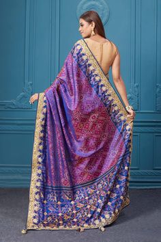 Look royal at weddings and festive occasions in this alluring purple embroidered Patola silk saree, It comes with a matching blouse piece. Disclaimer: The shown stitched blouse on the model is for display purpose only. The saree comes with a matching blouse piece and finished with fall and piko. Bollywood Style Purple Art Silk Pre-draped Saree, Purple Dola Silk Pre-draped Saree, Purple Silk Salwar Kameez With Zari Work, Silk Salwar Kameez With Zari Work In Purple, Purple Embroidered Silk Saree, Purple Pre-draped Saree With Dupatta, Purple Dola Silk Salwar Kameez With Zari Work, Purple Silk Embroidered Saree Fabric, Designer Traditional Wear With Intricate Embroidery In Purple