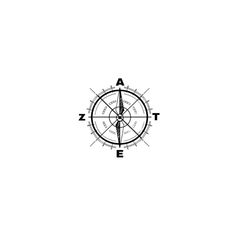 a black and white photo of a compass with the letter e in it's center