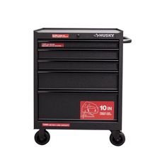 a black toolbox with wheels and red stickers on the top is shown in front of a white background