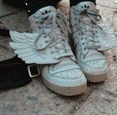 a pair of sneakers with wings on them