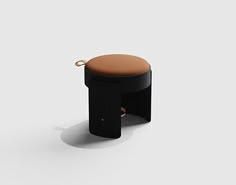 a black stool with a brown seat on it