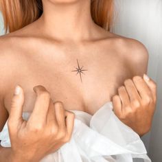 a woman with a star tattoo on her chest