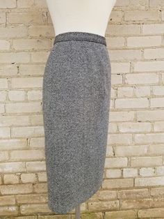 "1950s lovely black and white checked wool pencil skirt. This skirt is made of quite thick weight wool (burn test confirmed wool). The skirt closes with a 7\" Dart brand side metal zipper, with a thick black button. The skirt has 2 darts on either side on the front below the waist band and a really cool 4 dart span on the center back (see photo 6). There is lining on half of the back side of the skirt. This lining had a tear which I have secured with interfacing. Excellent condition with no issu Vintage Pencil Skirt For Fall, Fitted Tweed Pencil Skirt, 1950s Pencil Skirt, Tweed Pencil Skirt, Wool Pencil Skirt, Cotton Sundress, Rayon Dress, 1940s Dresses, Wool Skirts