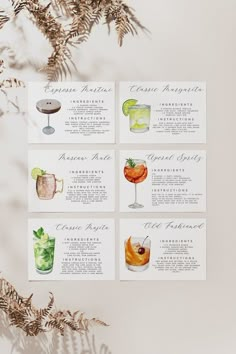 four cocktail menus with different drinks on them, sitting next to a tree branch