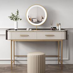 a dressing table with a mirror, stool and potted plant on it in front of a white wall