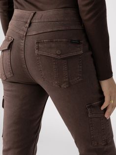 DETAILS Standard Rise Button Front and Zip Fly Closure 2 Front, 2 Back Flap, and 2 Side Cargo Pockets Hidden Elastic Back Waist Slim Straight Leg SIZE + FIT Model is 5'9 and is wearing a size 27. Waist: 27 1/4" Front Rise: 10 1/2" Inseam: 29" Leg Opening: 13" FABRIC + CARE 55% Cotton 29% Rayon 13% Polyester 3% Spandex Sculpted Twill Machine Wash Cold, Lay Flat to Dry Imported Brown Mid-rise Utility Cargo Pants, Brown Mid-rise Bottoms With Cargo Pockets, Utility Brown Mid-rise Cargo Pants, Brown Utility Style Mid-rise Cargo Pants, Mid-rise Brown Bottoms With Cargo Pockets, Brown Mid-rise Utility Pants, Brown Mid-rise Utility Bottoms, Fitted Brown Utility Bottoms, Brown High Rise Utility Pants