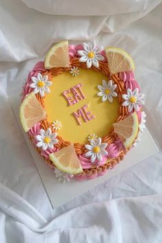 a cake decorated with flowers and lemon slices