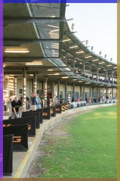 people are lined up on the sidelines at a baseball game in an empty stadium