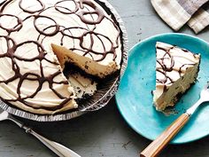 there is a cake on the table with a slice missing from it and two forks next to it