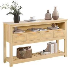 a wooden table with two drawers and baskets on the bottom shelf next to vases