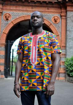 This men's African Print kente shirt with red embroidery is perfect for any special occasion such as traditional celebrations, events, weddings. Wash at 30 degrees. Wash similar colours, Hand wash for first wash. Also comes in sizes  S- 42 M - 44, L 46 , XL - 48, XXL 50 XXXL- 52  4XL - 54 . Delivery will be between 2 to 3 weeks for tailor-made products   A matching female one is also available to be made to match the shirt , please let me know the sizes and ill update you on prices Men African Fashion, Kitenge Designs, African Traditional Wedding Dress, Kente Print, Dashiki Shirt, Hot Skirts, African Attire For Men, African Shirts For Men, Sports Wear Women