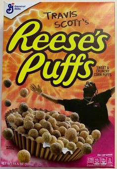 a box of reese's puffs sitting on top of a bed